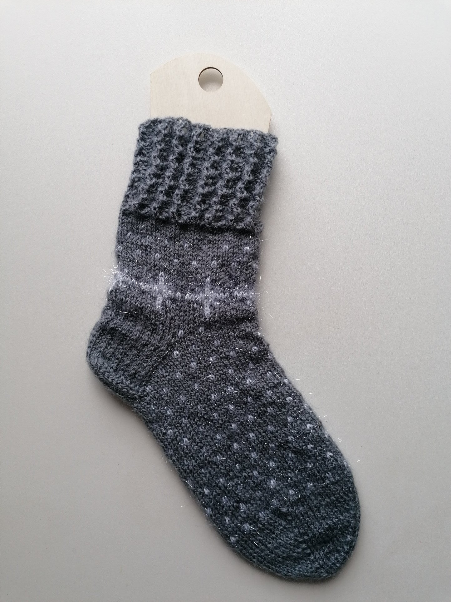 Gray textured sock on a white background