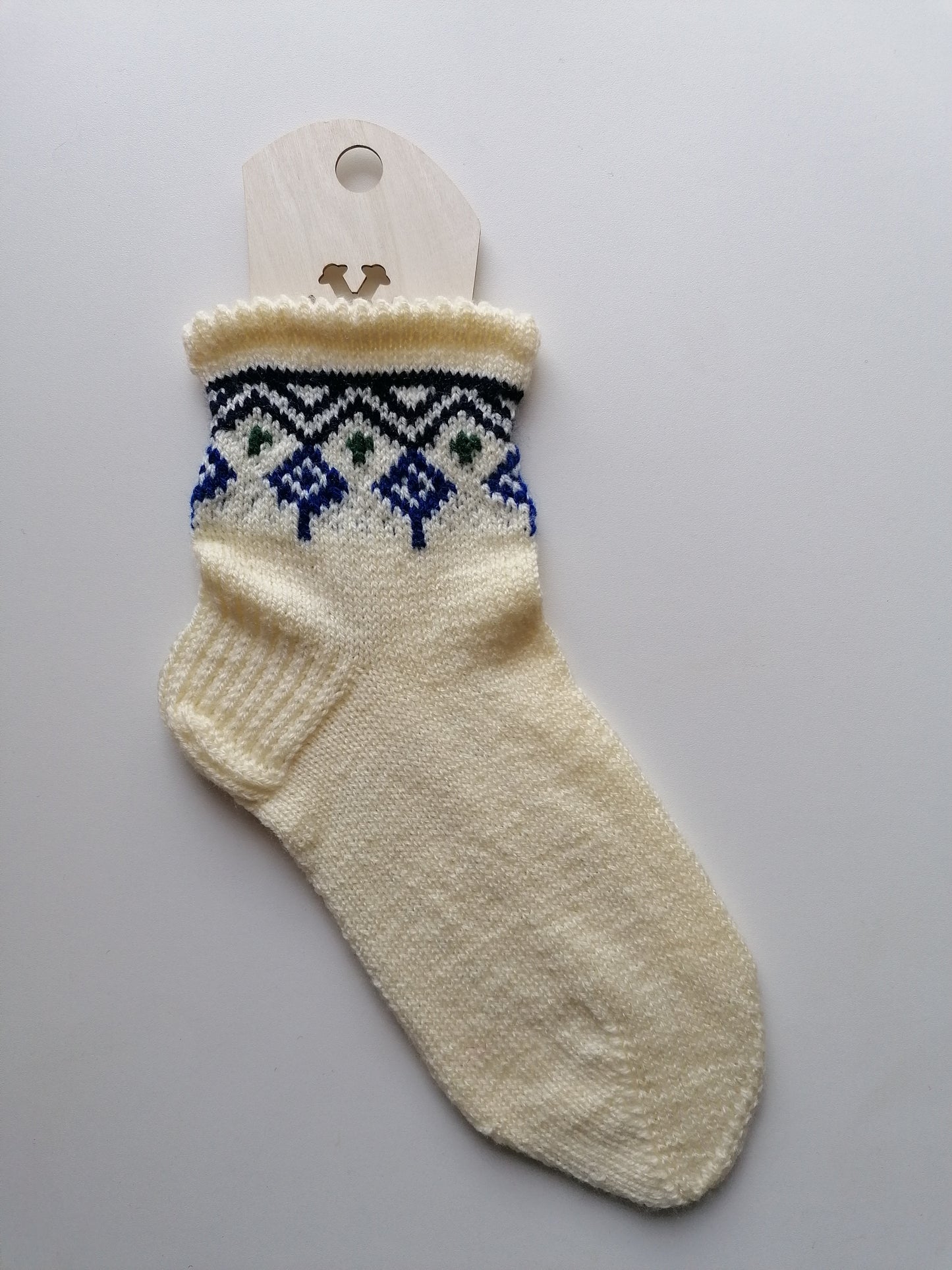Knitted dancer sock with a pattern on a white background