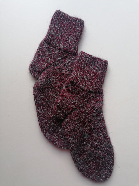 Pair of knitted socks on a white background