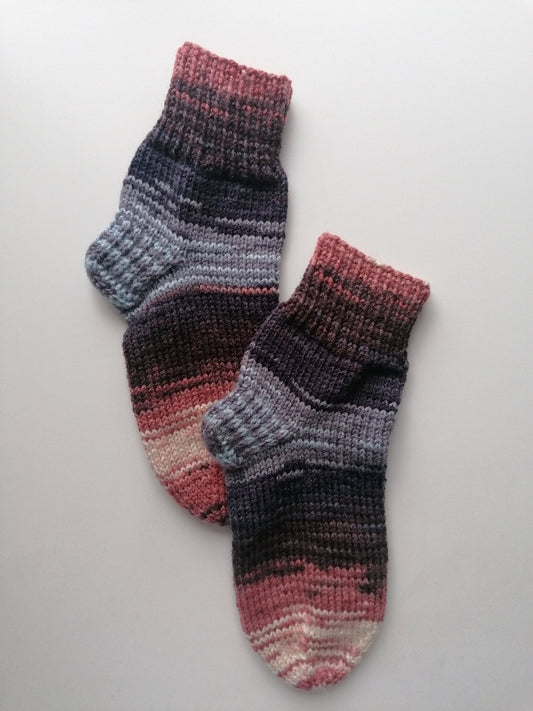 Pair of striped socks on a light gray background